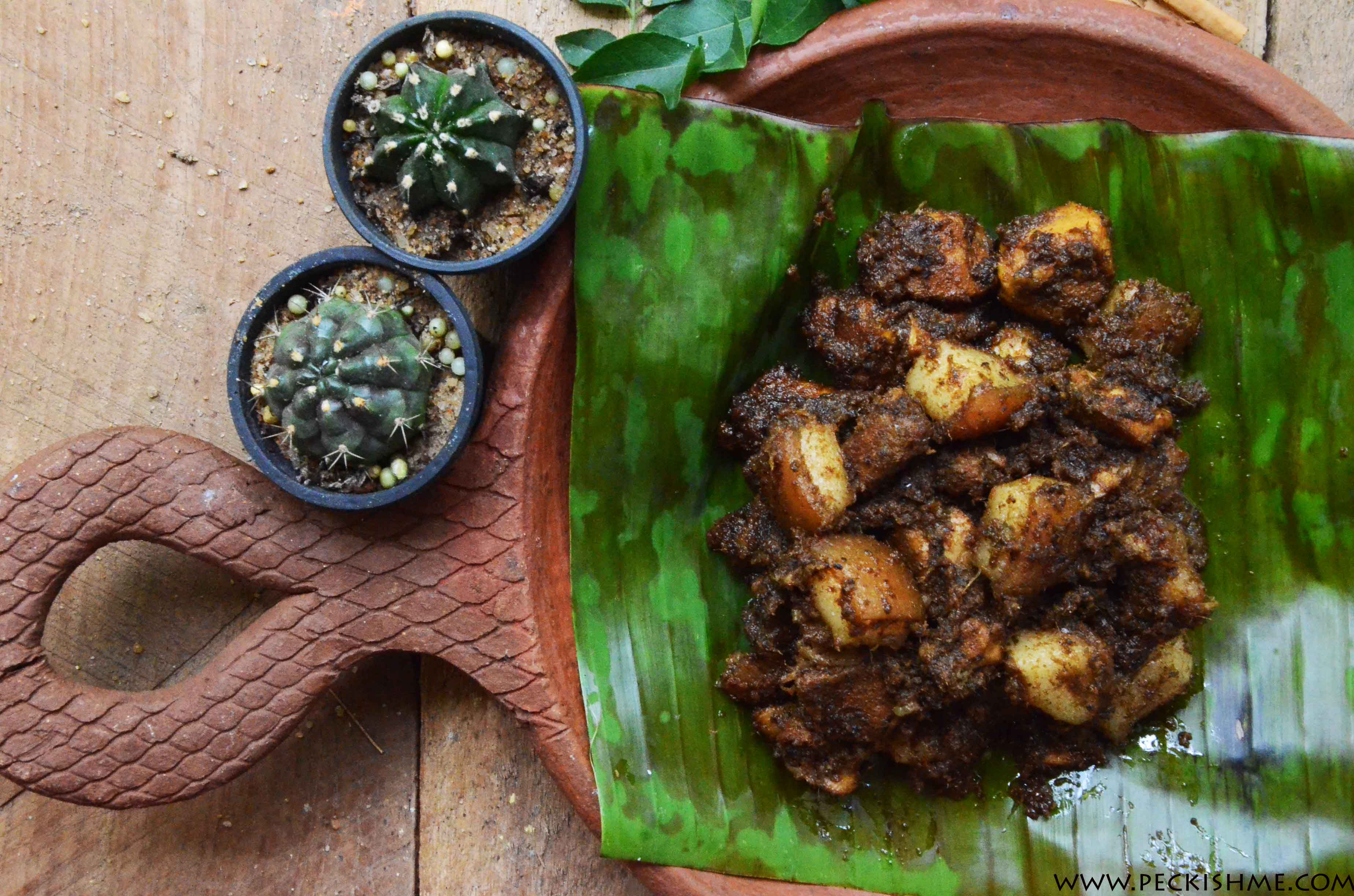 sri-lankan-pork-black-curry-on-banana-leaf